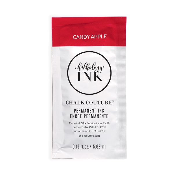 A small packet of Chalk Couture permanent ink in the color "Candy Apple," featuring a red and white design with product details and branding on the front. The packet contains 0.19 fl oz (5.62 ml) of ink.