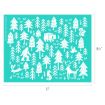 A teal stencil with white illustrations of pine trees, a Bigfoot, a bear, a deer, a fox, a rabbit, a bird, and a squirrel. The stencil measures 11 inches wide by 8.5 inches tall.