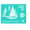 A stencil design featuring an A-frame cabin with pine trees, the words "COZY UP," a campfire, a marshmallow on a stick, and a flame icon. Dimensions are 11 inches wide by 8.5 inches tall.