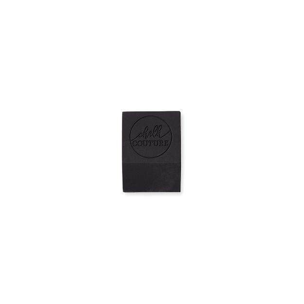 A small, rectangular black rubber squeegee with the words "Chalk Couture" embossed on the top surface, centered against a plain white background.