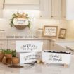 A bright kitchen displays herb planters labeled parsley, rosemary, and sage on a counter, with soil, pots, and a trowel nearby. Signs in the background read "Thyme for Courage" and "Journey Home.