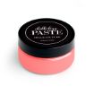 A round container of Chalkology Paste by Chalk Couture with a black lid and a label that reads "Chalkology Paste, Chalk Couture, Washable Paste." The container is pink in color and placed on a white background.
