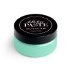 A round container of Chalk Couture Chalkology Paste with a black lid and a mint green-colored paste inside. The label on the lid reads "chalkology PASTE, CHALK COUTURE, WASHABLE PASTE.