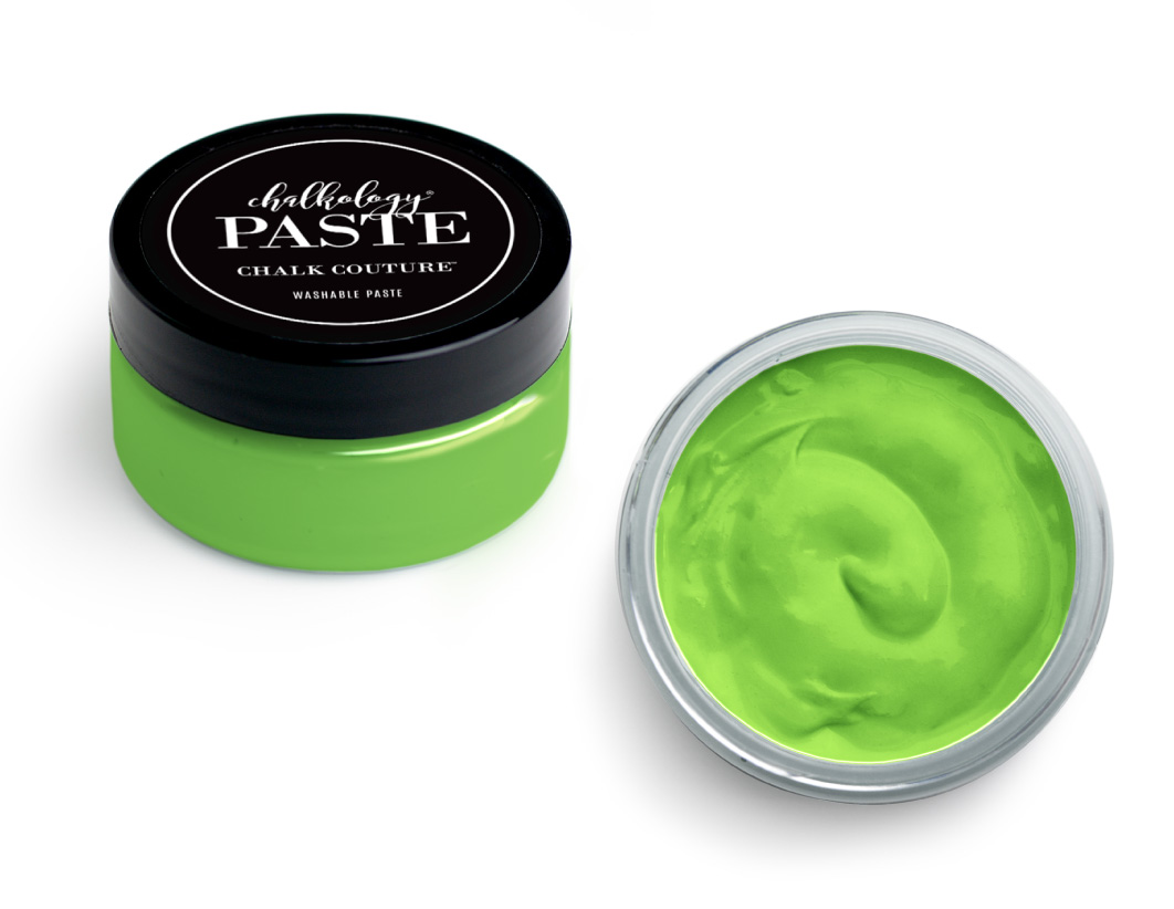 A small, round container of vibrant green chalk paste with a black lid labeled "Chalkology Paste Chalk Couture," shown both closed and with the lid off to reveal the smooth, creamy paste inside.