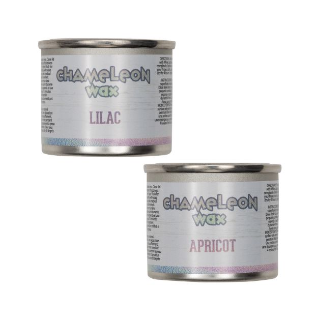 Two small metal tins of Chameleon Wax, one labeled "Lilac" and the other "Apricot," with iridescent accents on the labels and plain white backgrounds.