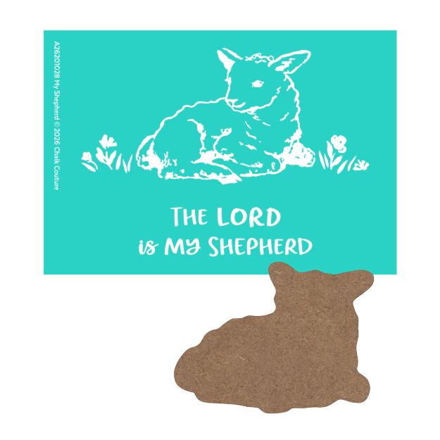 A greeting card with a white outline of a lamb lying in grass on a teal background. Below it, text reads "The Lord is my shepherd." A brown lamb-shaped cutout is positioned beneath the card.