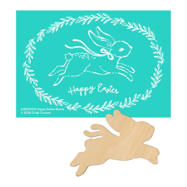 A teal card with a white illustration of a leaping bunny surrounded by a laurel wreath, with "Happy Easter" written below. A wooden cutout of the same bunny lies beneath the card.