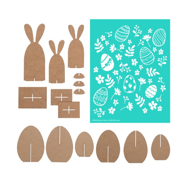 Laser-cut brown cardboard bunny and egg shapes with slots, arranged next to a teal stencil featuring white Easter egg and floral designs. All pieces are laid out on a white background.