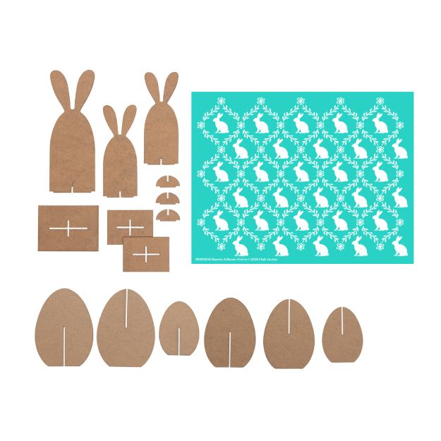 Cut-out pieces of brown cardboard shaped like bunnies and eggs, alongside a teal stencil sheet decorated with white bunny and leafy wreath designs, all arranged on a white background.