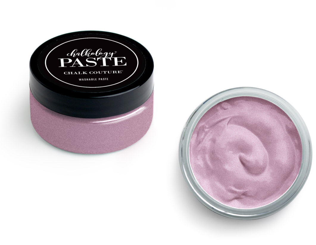A small jar of Chalkology chalk paste with a black lid, shown closed on the left and open on the right, revealing smooth, light pink paste inside.