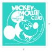 Turquoise square featuring a white outline drawing of Mickey Mouse’s face with the text “Mickey Mouse Club” and “Official Member.” Signature of Walt Disney and phrases “He talks. He sings. He dances.” also appear.