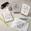 A stationery set with Disney Winnie-the-Pooh characters: a stapler, coffee mug, two quote cards on stands, a spiral notebook, a pencil, markers, and a white pouch, all with character illustrations and cheerful quotes.