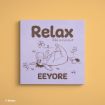 A pastel purple square canvas with an illustration of Eeyore lying on his back among flowers. Text above reads "Relax, take a moment" and below, "EEYORE." The Disney logo is in the bottom left corner.