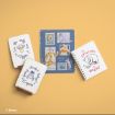Disney Winnie the Pooh-themed stationery sits on a yellow surface, including notebooks and a binder featuring illustrations of Tigger, Eeyore, and Pooh with playful quotes and stamp designs.