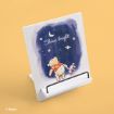A wooden stand features an illustration of Winnie the Pooh and Piglet holding hands, looking up at a night sky with stars, a crescent moon, and the words "Shine bright" written above them.