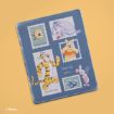 A blue notebook with illustrations of Winnie the Pooh characters, including Pooh, Piglet, Tigger, and Eeyore, plus honey, and blueberries, designed like postage stamps. The words "Sincerely yours..." are written in the center.