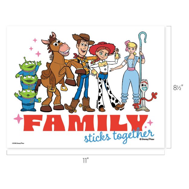Toy Story characters stand together smiling, including three green aliens, Bullseye, Woody, Jessie, Bo Peep, and Forky. Below them, the words "FAMILY sticks together" are written in bold red and blue letters.