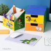 A desk organizer and small drawer set decorated with Toy Story characters, including Buzz Lightyear, Jessie, Slinky Dog, Hamm, and Rex, hold office supplies next to a mouse on a Rex mousepad.