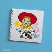 A spiral-bound notebook with a cover illustration of Jessie from Toy Story, smiling with hands on her cheeks, against a white background with abstract yellow and pink shapes. "Jessie" is written in blue script.