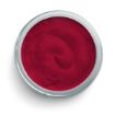 A top-down view of an open round container filled with smooth, vibrant red cream or gel, set against a white background.