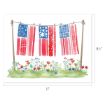 Watercolor illustration of red, white, and blue patterned quilts hanging on a clothesline between two poles, with flowers and grass below. The image measures 11 by 8.5 inches.