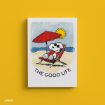 A cartoon dog wearing sunglasses relaxes on a beach chair under a red umbrella, with the sun and ocean in the background. Text below reads "THE GOOD LIFE.