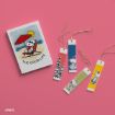 A notepad featuring Snoopy relaxing under a red umbrella with "THE GOOD LIFE" text, next to four colorful bookmarks with Snoopy illustrations, all placed on a pink background.