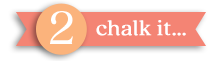 A peach-colored circle with a white number 2 overlaps a coral ribbon displaying the text "chalk it..." in white lowercase letters.