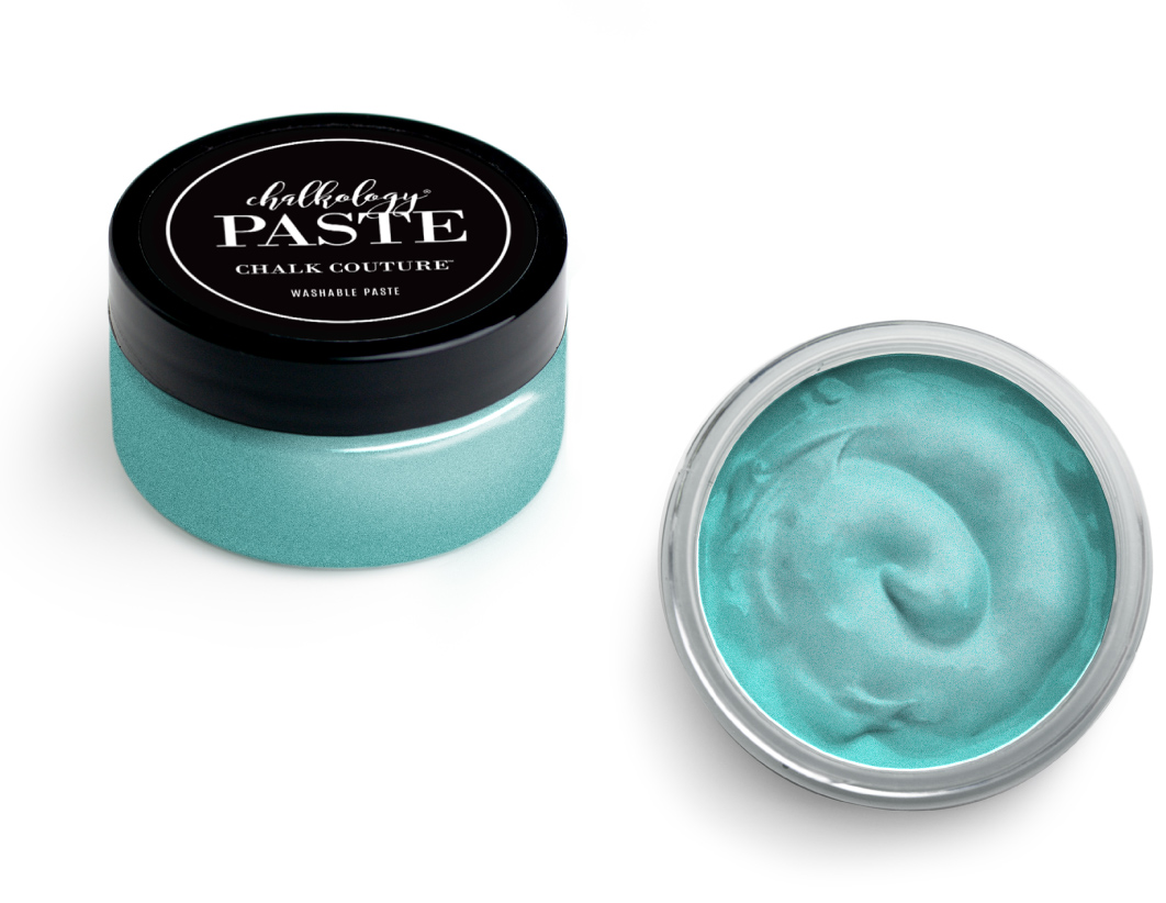 A small round jar with a black lid labeled "Chalkology Paste, Chalk Couture, Washable Paste" sits next to an open jar showing smooth, teal-colored paste inside.