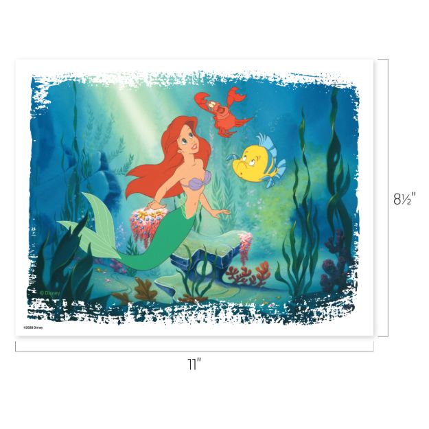 A mermaid with long red hair swims underwater with a yellow fish and a red crab, surrounded by seaweed and coral. The scene is colorful and lively, with soft sunlight filtering through the water.