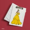 A white clipboard features an illustration of Belle from Disney’s Beauty and the Beast, wearing her signature yellow gown. The clipboard rests on a closed white folder against a solid red background.