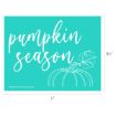 Teal sign with white script text reading "pumpkin season," featuring a white outline drawing of a pumpkin with a leaf. Dimensions shown are 11 inches wide by 8.5 inches tall.
