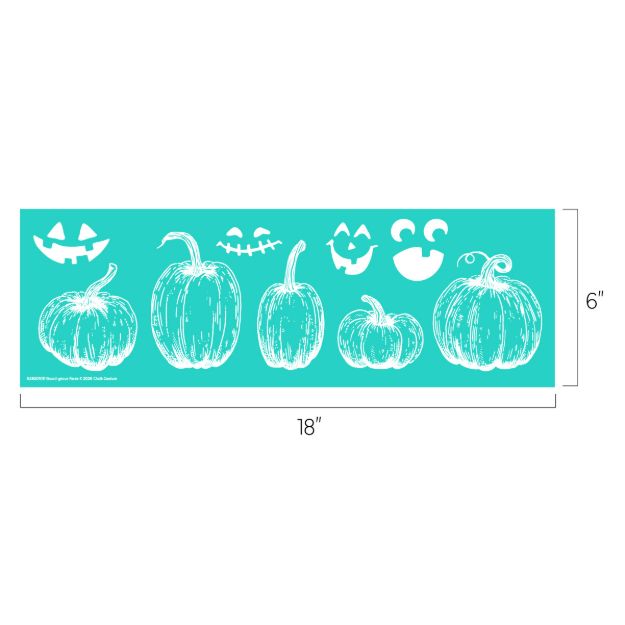 A teal stencil sheet, 18 inches by 6 inches, featuring white outlines of five pumpkins and three different jack-o’-lantern face designs above them.