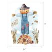 A friendly scarecrow with a pumpkin head, blue overalls, and a hat stands on a pile of autumn leaves, surrounded by tall grasses, with a blue sky background. Dimensions are 8.5" wide by 11" tall.