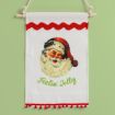 A festive wall hanging with a vintage Santa Claus illustration, red trim, and the green text "Feelin' Jolly" on white fabric, displayed against a light green background.