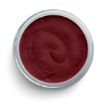 A round, open container filled with smooth, dark red cream or paste, viewed from above against a white background.