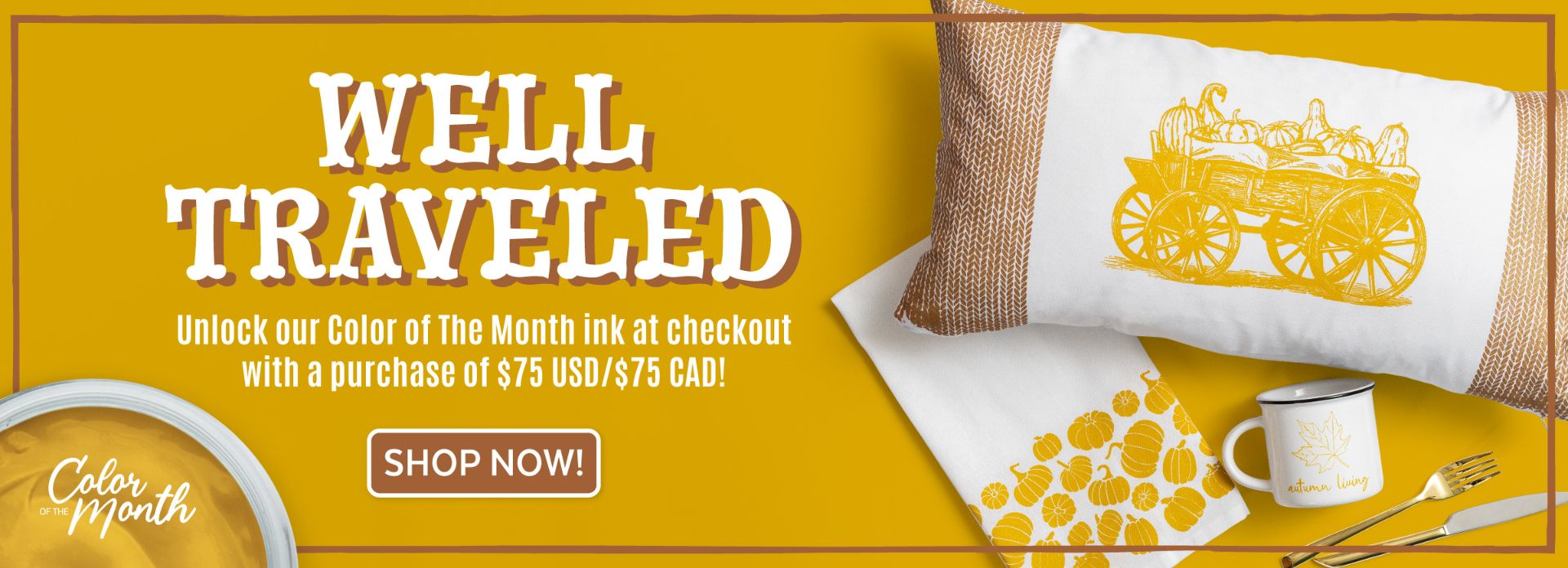 A fall-themed promotional banner with “Well Traveled” text, highlighting a color of the month offer. Features a pillow, mug, and towel with yellow pumpkin and wagon designs on a yellow background. Button says “Shop Now!”.