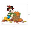 Mickey Mouse wearing a red hat and green shirt stands by a wooden basket filled with pumpkins and corn, surrounded by autumn leaves. Image size is 11" x 8.5".