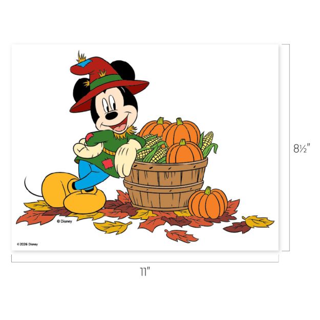 Mickey Mouse wearing a red hat and green shirt stands by a wooden basket filled with pumpkins and corn, surrounded by autumn leaves. Image size is 11" x 8.5".