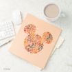 A peach folder with a Mickey Mouse head made of autumn leaves sits on a desk near a keyboard, mouse, and a mug of coffee.