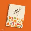 A spiral notebook with a drawing of Mickey Mouse holding a football, above colorful autumn leaves, pumpkins, and gourds. The background is orange. © Disney is in the bottom left corner.