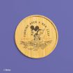 A round bamboo tray features Mickey Mouse sweeping leaves with the text "Turning over a new leaf" and "Mickey Mouse." The background is purple, and the Disney logo is in the lower-left corner.