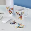 Disney-themed mug, bottle, and coasters with Mickey, Minnie, and Donald Duck in autumn scenes on a white desk beside a computer mouse. Blue wall background.