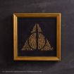 A gold-framed picture with the Deathly Hallows symbol made from gold text phrases on a black background, referencing elements from the Harry Potter series.