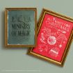 Two framed posters: one green with "Ministry of Magic" text, and one red with "All I Want For Christmas" and Harry Potter-themed illustrations, both in gold frames on a green background.