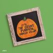 A wooden-framed blackboard features a painted orange pumpkin with the words, “IT’S THE GREAT PUMPKIN, CHARLIE BROWN,” on a green background.