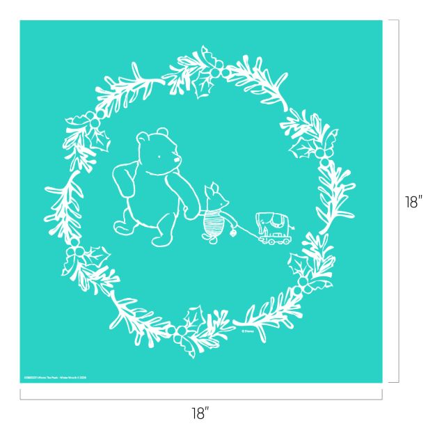 White line art of a bear, piglet, and toy wagon inside a holiday wreath of leaves and berries on a teal square background. The dimensions are 18 by 18 inches.