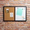 A corkboard and whiteboard hang on a brick wall. The corkboard has a small photo and a weekly list. The whiteboard has colorful alphabet magnets and cut-out letters spelling “THINK THINK THINK.”.