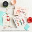 Three Christmas-themed cards featuring Winnie the Pooh characters, festive phrases like “Warm & Cosy” and “Kinda Feels Like Christmas,” paint jars, and a mint green card on a white surface.
