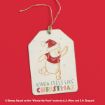 A gift tag with Winnie the Pooh in a Santa hat and scarf, surrounded by snowflakes, with the text “KINDA FEELS LIKE CHRISTMAS” on a red background.
